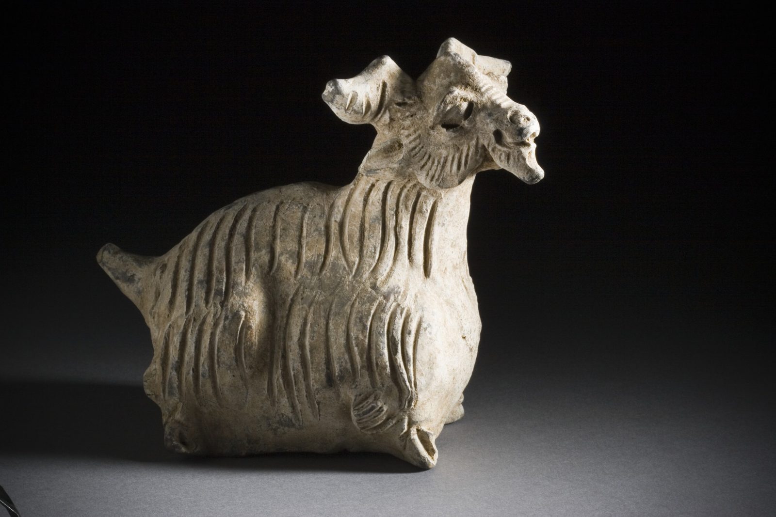 Earthenware funerary sculpture of a goat from a set of the twelve Chinese zodiac animals, Yuan dynasty