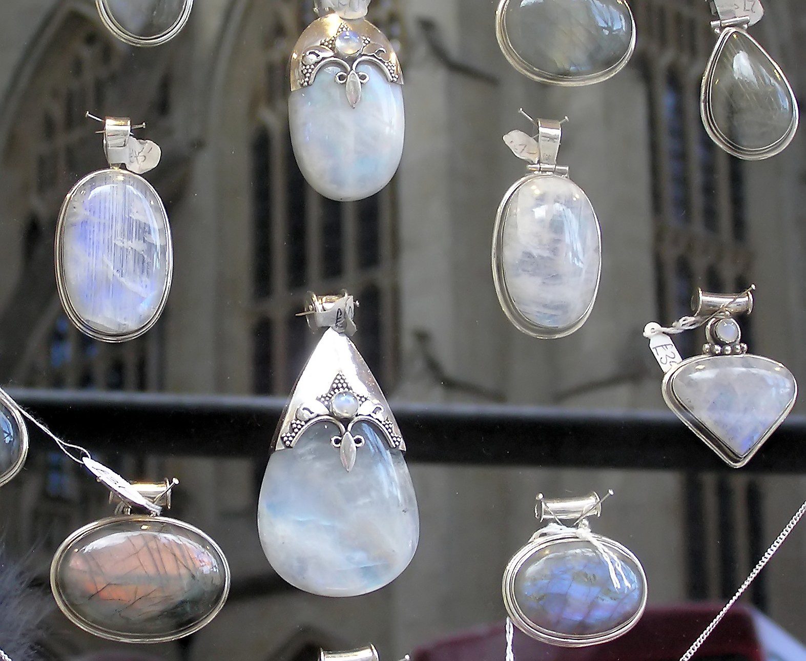 Polished, translucent moonstone cabochons displayed in a jeweller's shop window