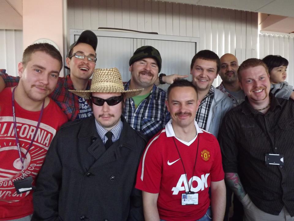 A group of Mo Bros displaying the moustaches they grew for Movember